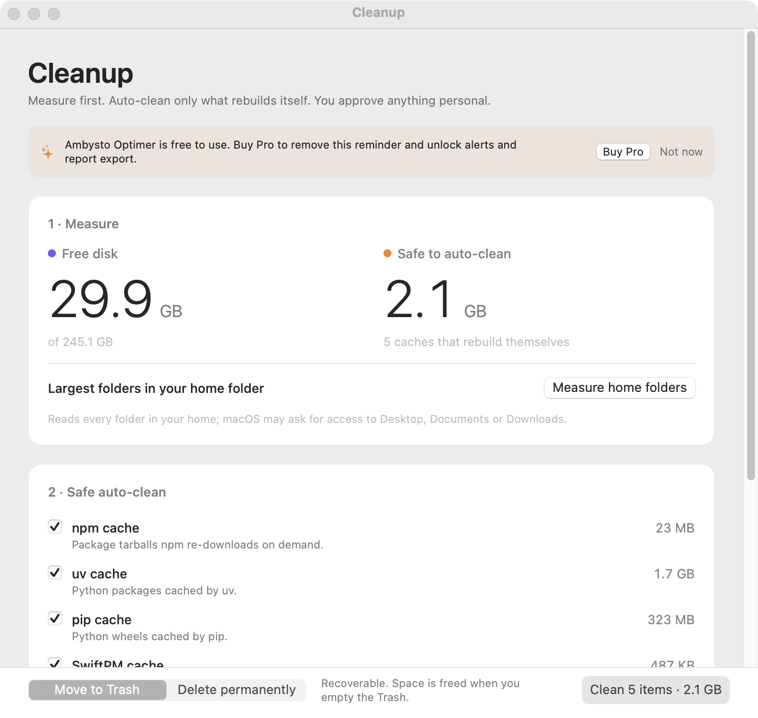 The Cleanup window, step one: 29.9 GB free of 245.1 GB and 2.1 GB safe to auto-clean across five caches, with a Move to Trash toggle.