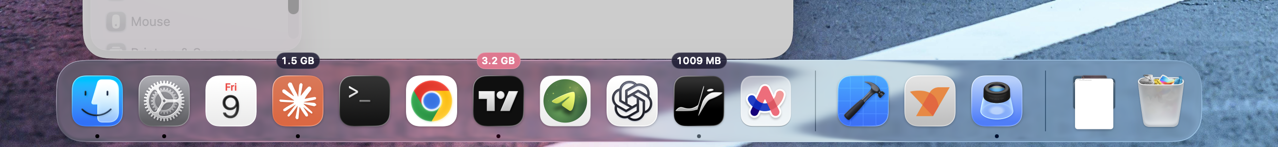 The macOS Dock with memory badges floating above heavy apps: 1.5 GB, 3.2 GB in the warning colour, and 1009 MB.